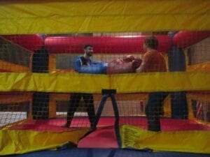 Two students playfully battle it out in the bounce house.  Danyell Luster/ TNJN 