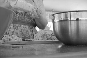 A baker prepares ingredients. Photo by Ryan McGill. 