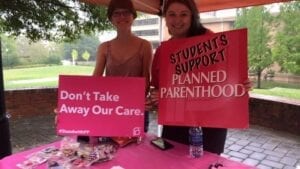 SHAG member, Lauren Huguenard and co-chair, Victoria Long set up a table to show their support for Planned Parenthood. //Photo courtesy of SHAG