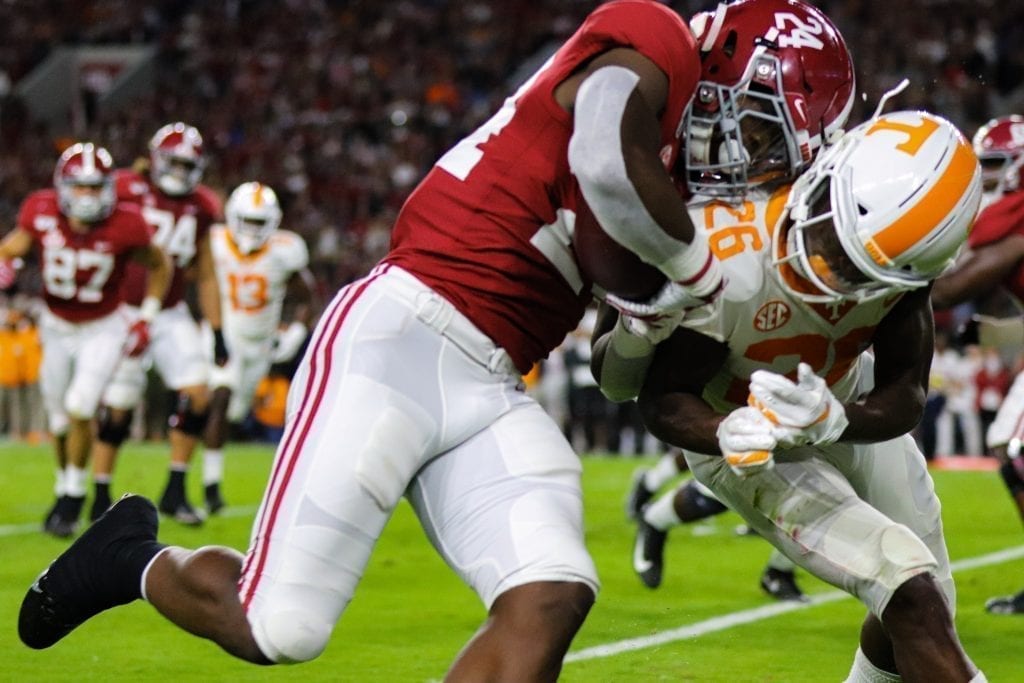 Tennessee's Theo Jackson (26) and Alabama running back Najee Harris (24) collide at the goal line when Tennessee played Alabama in Tuscaloosa on Oct. 19, 2019. Photo/ Ben Gleason
