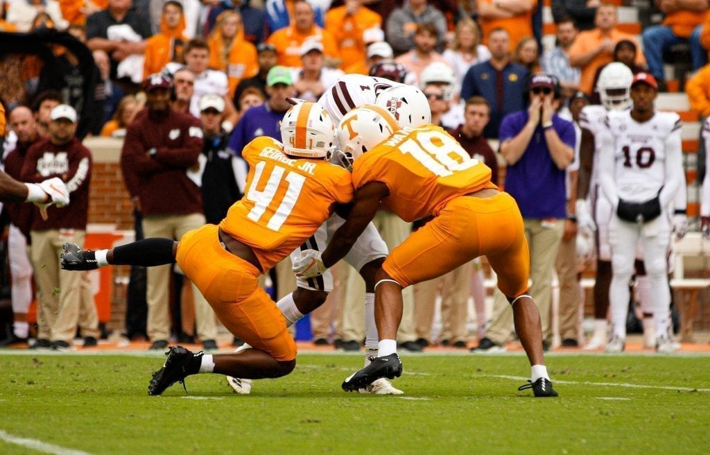 Tennessee defensive backs gang tackle a Mississippi State ball carrier on Oct. 12, 2019 in Knoxville, Tennessee. Photo/ Ben Gleason