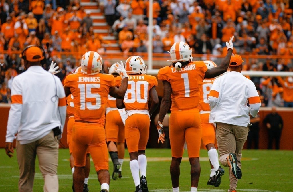 Tennessee wide receiver Juaun Jennings (15) and Marquez Callaway (1) hold up 'fours' for the fourth quarter on Oct. 12, 2019 in Knoxville, Tennessee. Photo/ Ben Gleason