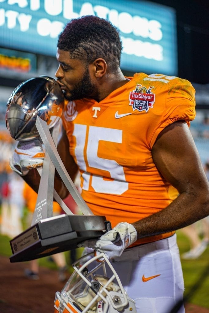 Tennessee wide receiver Jauan Jennings (15) kisses the game trophy when Tennessee played Indiana in the Tax Slayer Gator Bowl on Jan. 1, 2020. Photo/ Ben Gleason